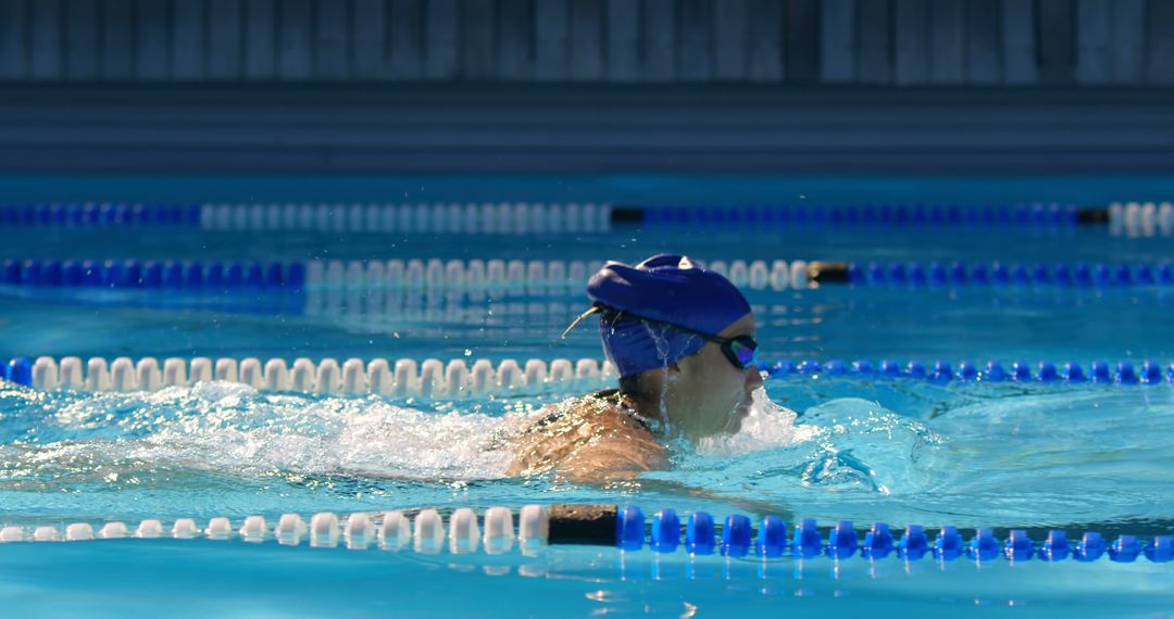 Female Athlete Breathing in Swimming Pool during Training Session - Free Images, Stock Photos and Pictures on Pikwizard.com