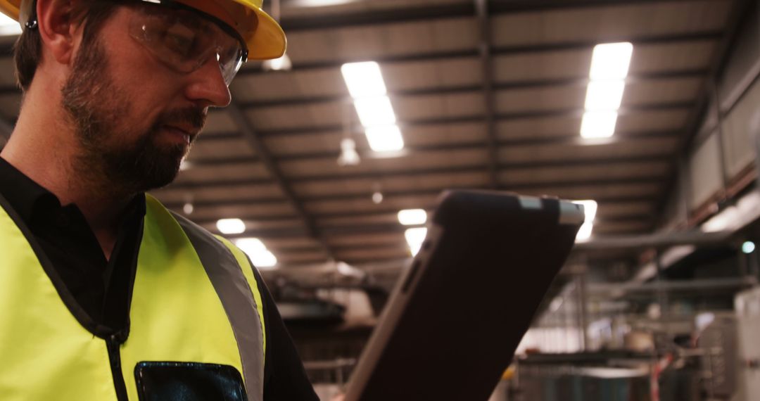 Male Engineer Using Digital Tablet in Industrial Factory - Free Images, Stock Photos and Pictures on Pikwizard.com