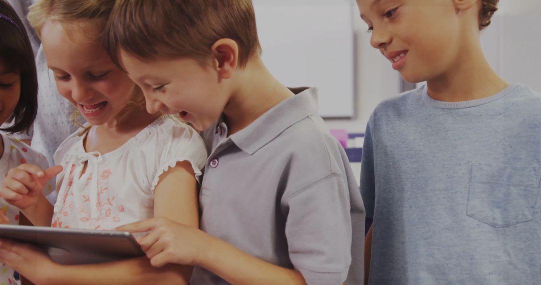 Children Collaborating on Tablet in Classroom