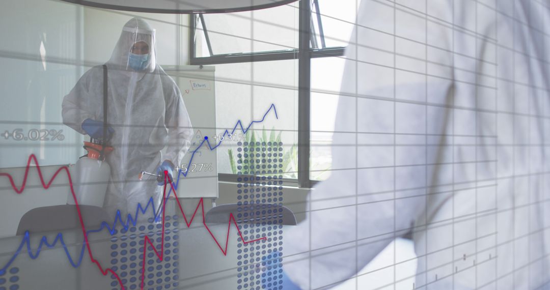 Healthcare worker in protective gear disinfecting office amid pandemic with financial graphs - Free Images, Stock Photos and Pictures on Pikwizard.com