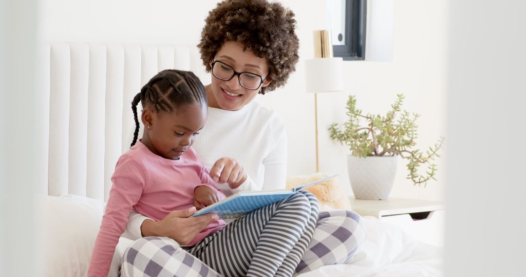 Diverse Mother and Daughter Enjoying Bedtime Reading
