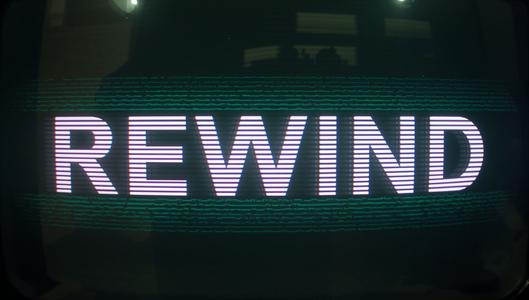 REWIND Neon Text on Curved CRT Monitor with Scanline Glitches and Retro Analog Look