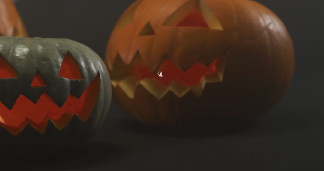 Spooky Carved Pumpkins with Glowing Faces on Halloween