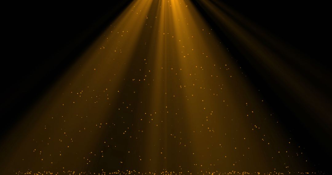 Golden Light Rays with Falling Confetti on Black Background