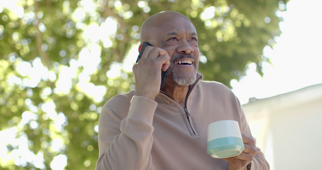 Mature African American Man Talking on Phone Outdoors - Free Images, Stock Photos and Pictures on Pikwizard.com