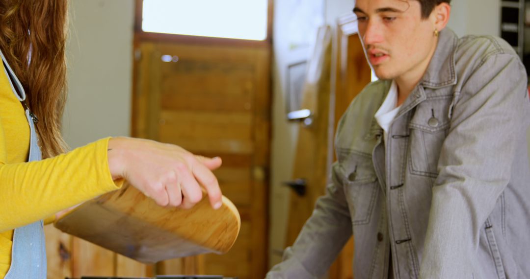 Young Friends Relaxing at Home with Drinks in Kitchen