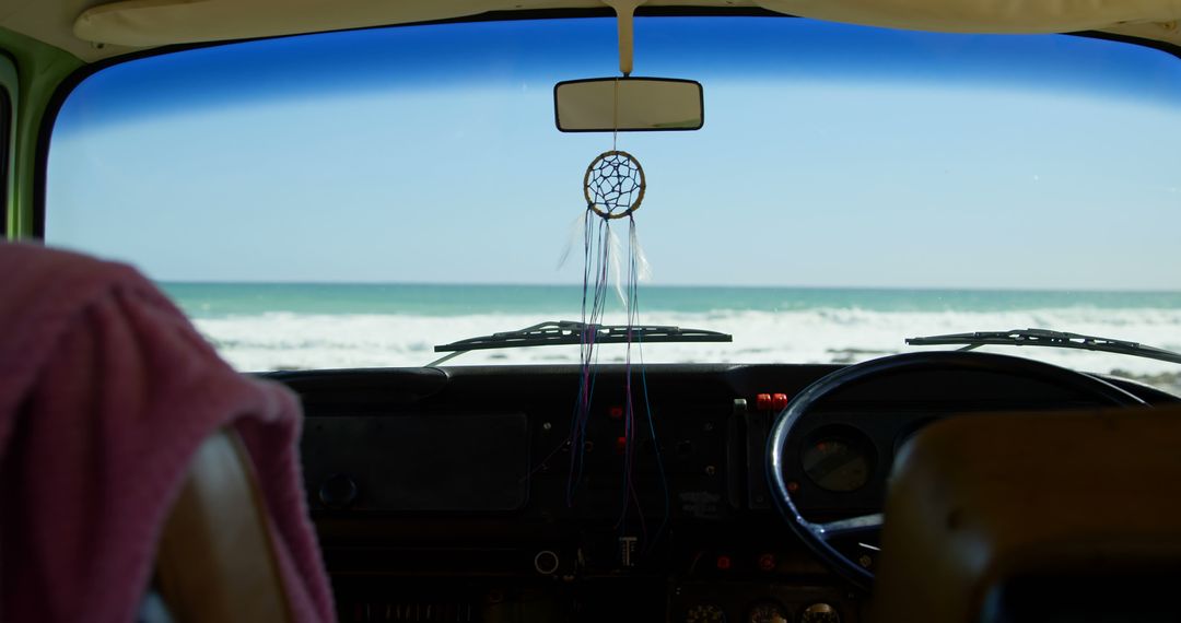 Van Interior with Dreamcatcher Overlooking Beach - Free Images, Stock Photos and Pictures on Pikwizard.com