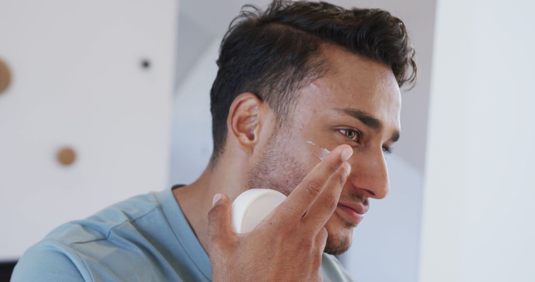 Man Applying Facial Cream as Part of Daily Skincare Routine - Free Images, Stock Photos and Pictures on Pikwizard.com