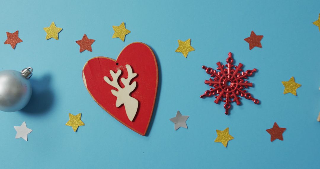 Image of homemade christmas decorations with stars on blue background - Free Images, Stock Photos and Pictures on Pikwizard.com