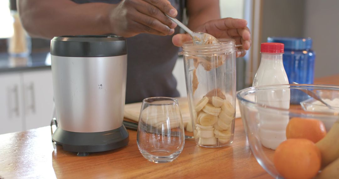 Preparing Nutritious Smoothie with Peanut Butter and Bananas