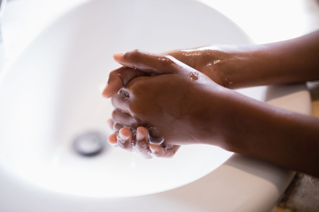Cropped image of person washing hands at sink - Free Images, Stock Photos and Pictures on Pikwizard.com