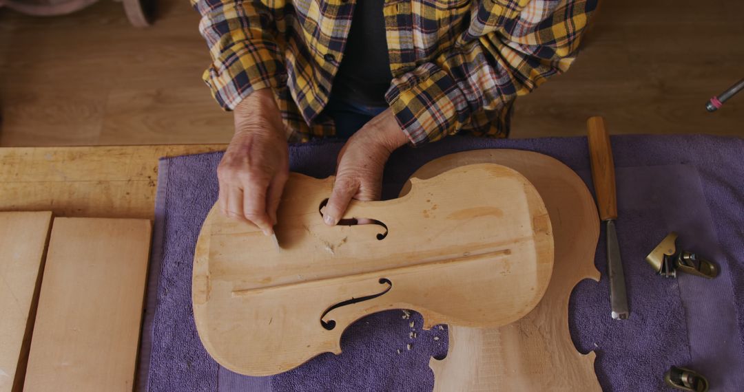 Craftsman Shaping Violin Body in Workshop - Free Images, Stock Photos and Pictures on Pikwizard.com