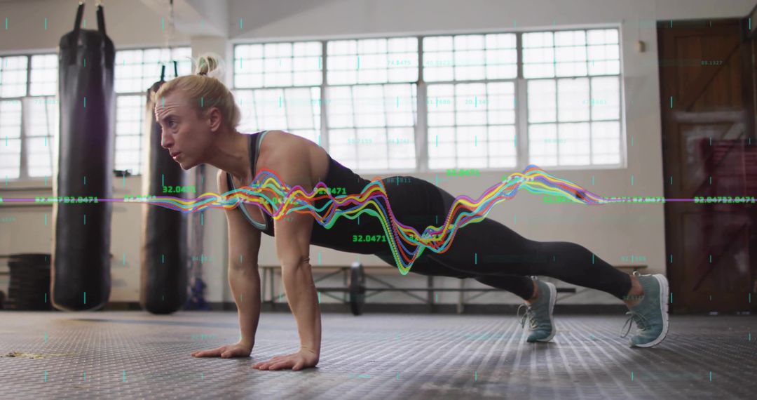 Woman Performing Push-Up in Gym with Biometric Waveform Overlay