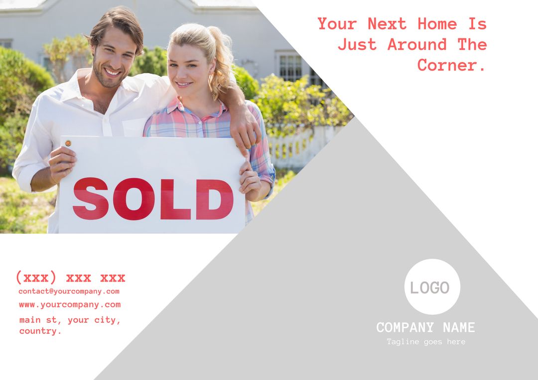 Happy Couple with Sold Sign in Front of New Home