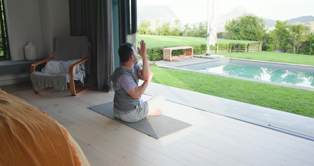 Man Practicing Yoga by Poolside in Natural Light