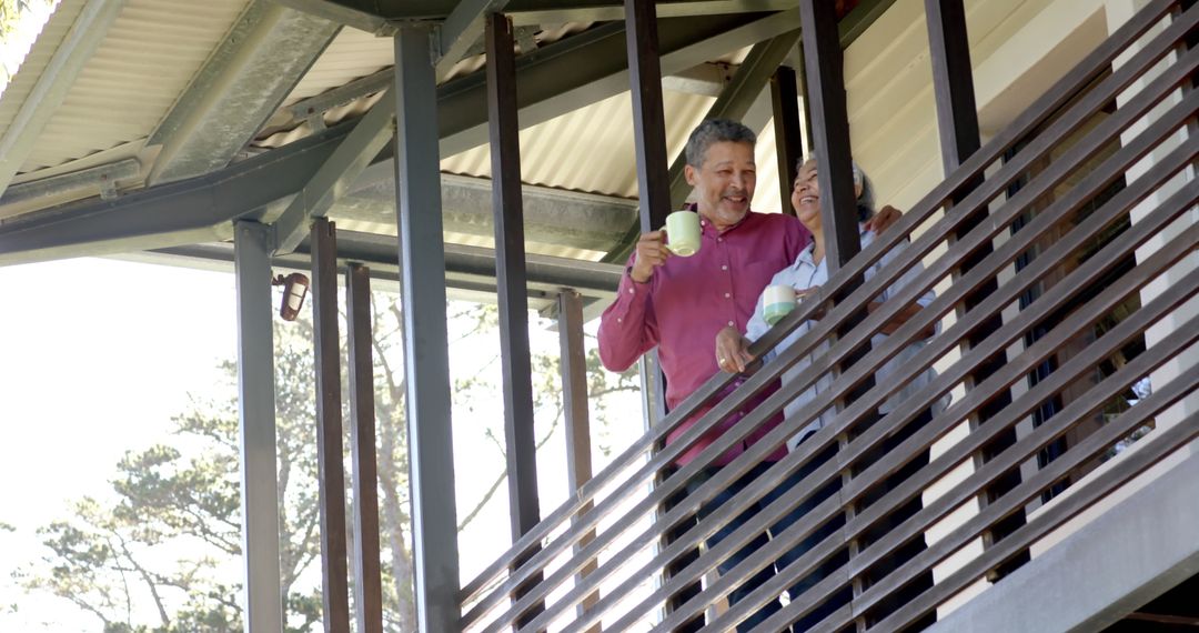 Senior Couple Enjoying Tea and Conversation on Balcony - Free Images, Stock Photos and Pictures on Pikwizard.com