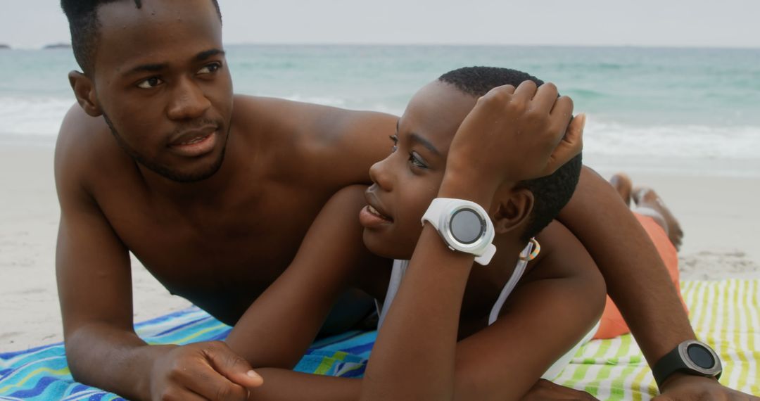 Couple Relaxing on Beach Together