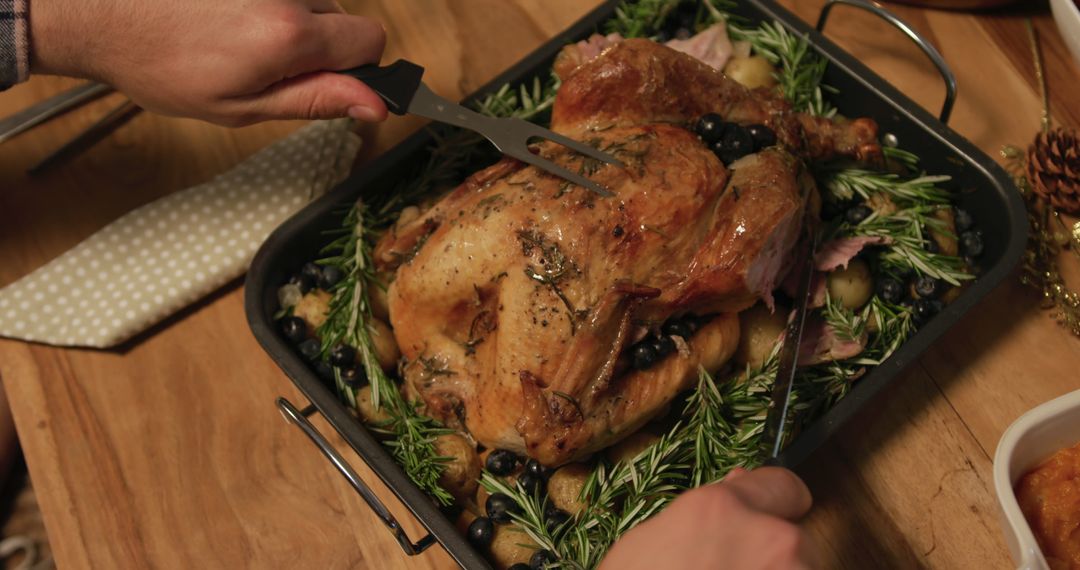 Person Preparing Herb Roasted Turkey for Festive Meal - Free Images, Stock Photos and Pictures on Pikwizard.com