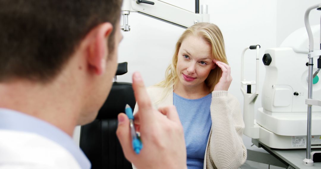 Optometrist Conducting Eye Exam for Patient in Modern Clinic - Free Images, Stock Photos and Pictures on Pikwizard.com