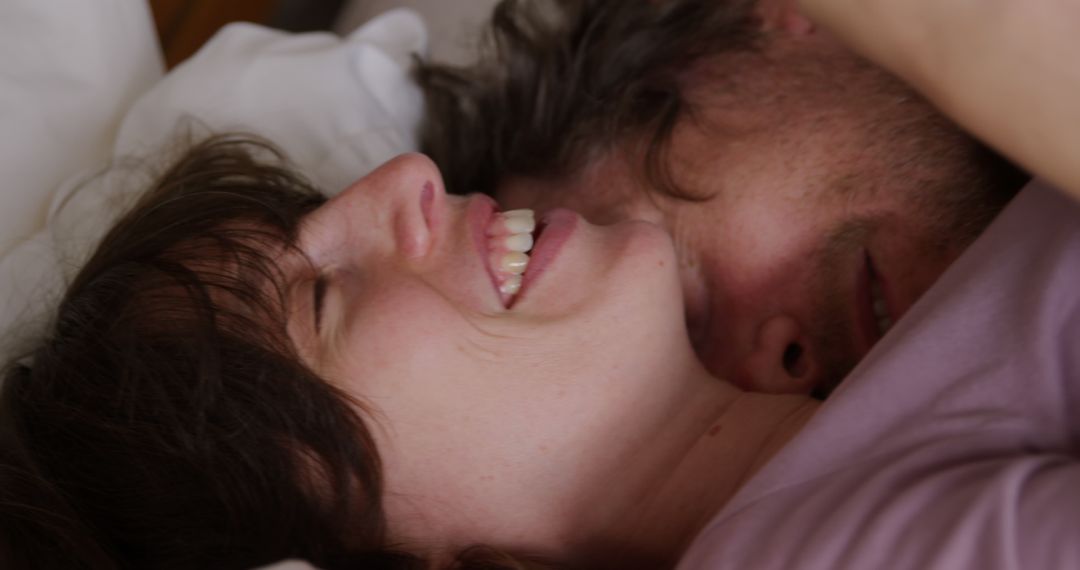 Joyful Couple Sharing Tender Moment in Cozy Home Setting