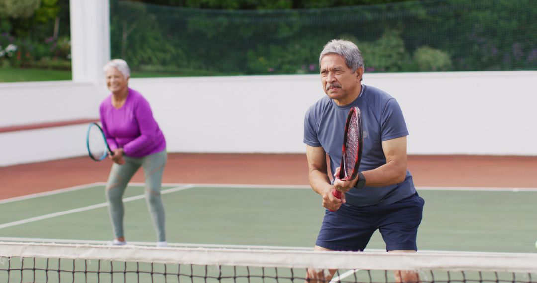Senior Couple Enjoying Tennis Game for Active Lifestyle