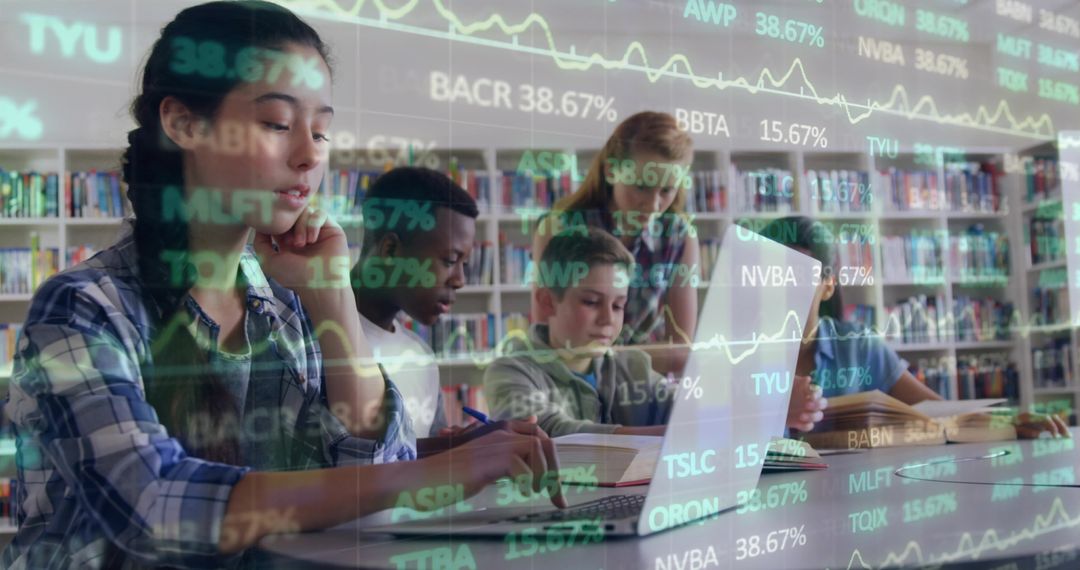 Teen Students Collaborating in Library Analyzing Financial Data with Laptops and Books