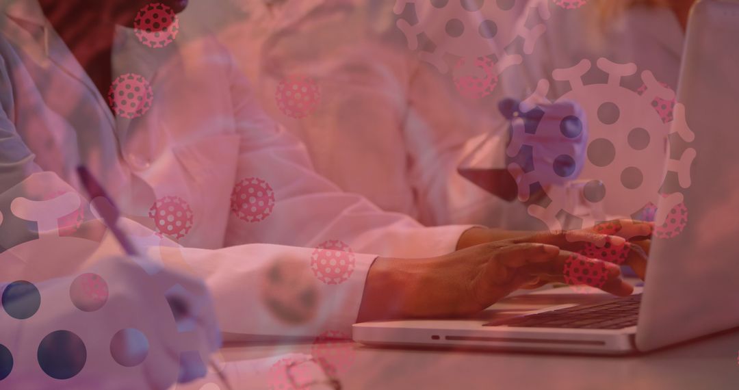 Laboratory Team Analyzing Covid-19 Data on Laptop