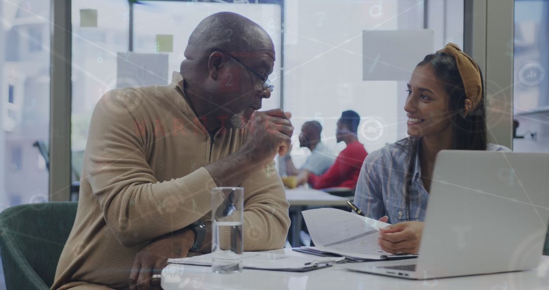 Multicultural Team Collaborating in Modern Office with Digital Finance Overlay