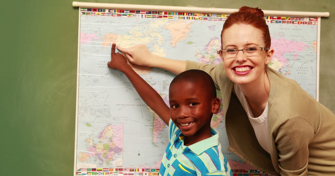 Teacher and Student Pointing at World Map in Classroom - Free Images, Stock Photos and Pictures on Pikwizard.com