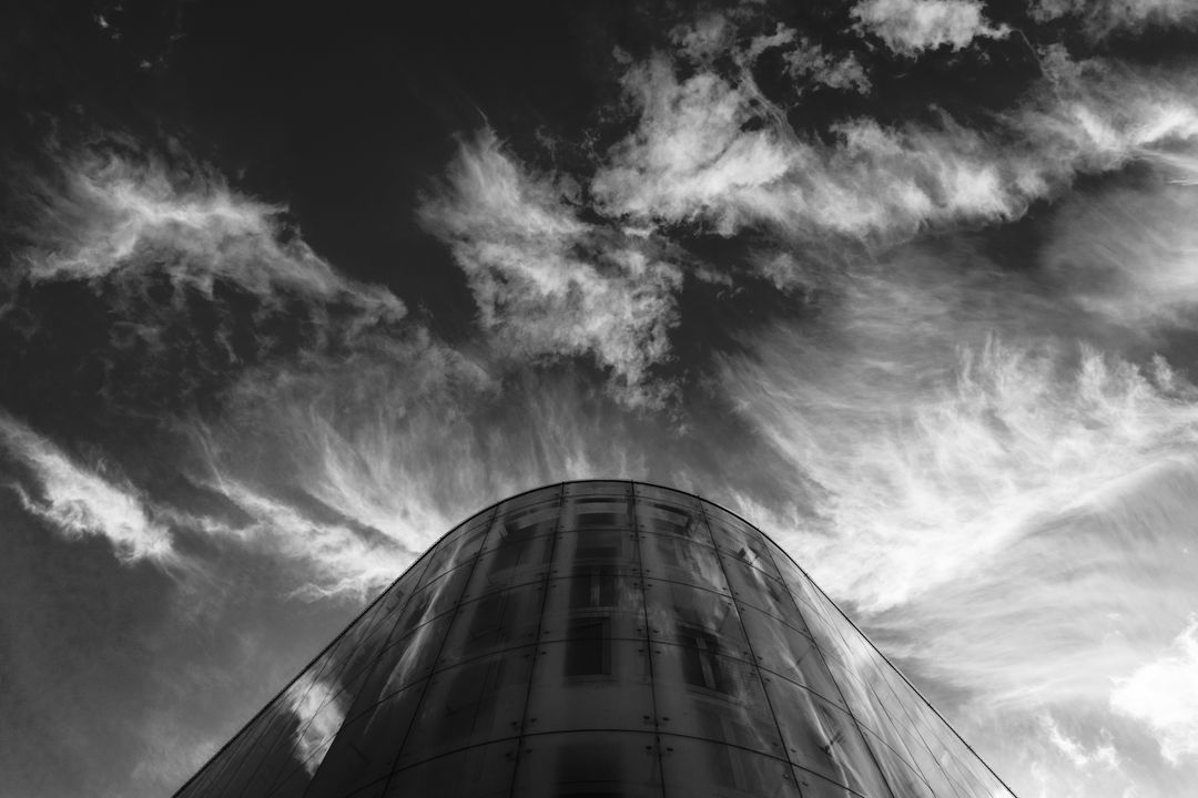 Modern Building with Dramatic Cloudy Sky in Black and White - Free Images, Stock Photos and Pictures on Pikwizard.com