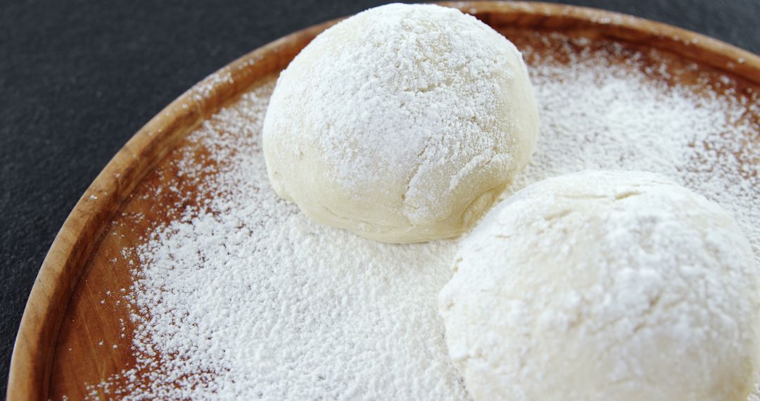 Homemade Bread Dough Sprinkled with Flour on Wooden Plate - Free Images, Stock Photos and Pictures on Pikwizard.com