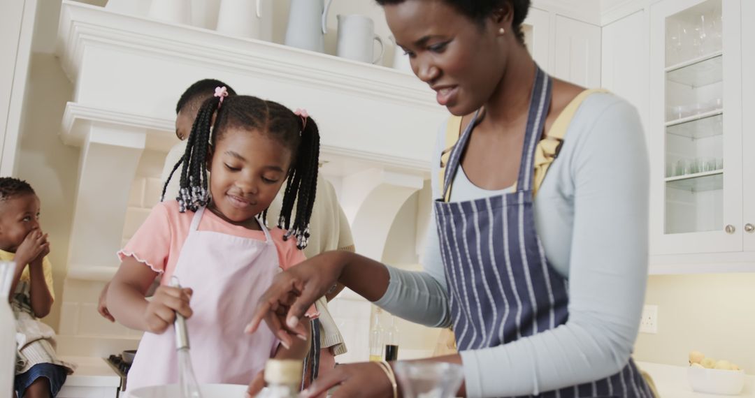 African American Family Enjoying Baking Together in Modern Kitchen - Free Images, Stock Photos and Pictures on Pikwizard.com