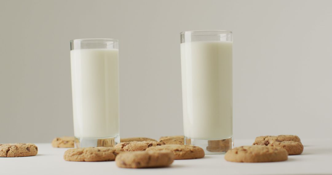 Image of biscuits with chocolate and milk on white background - Free Images, Stock Photos and Pictures on Pikwizard.com