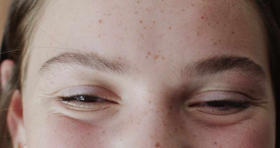 Close-Up of Relaxed Young Woman's Eyes with Freckles - Free Images, Stock Photos and Pictures on Pikwizard.com