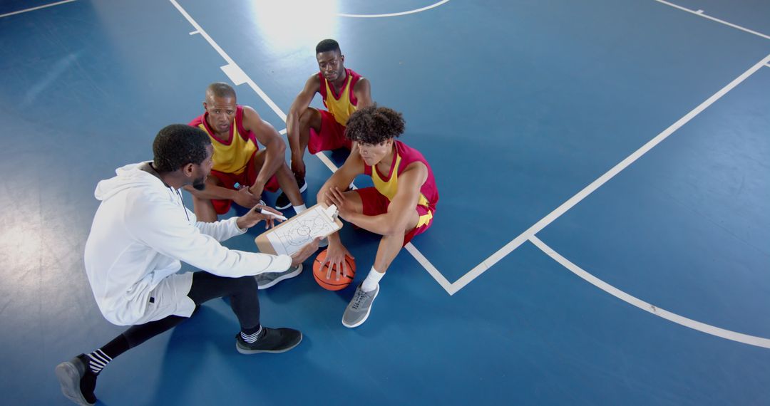 Basketball Players in Huddle for Team Strategy Session