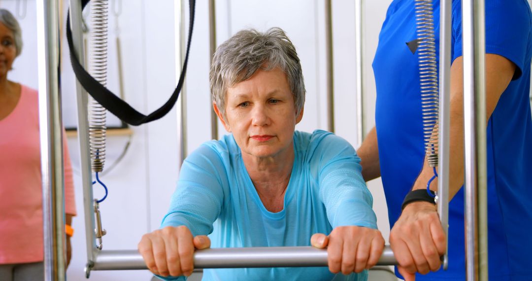 Senior Woman Exercising with Guidance in Rehabilitation Center - Free Images, Stock Photos and Pictures on Pikwizard.com