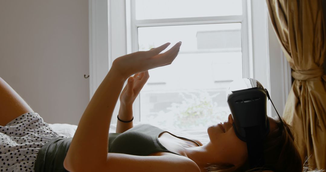 Young Woman Relaxing with Virtual Reality Headset - Free Images, Stock Photos and Pictures on Pikwizard.com