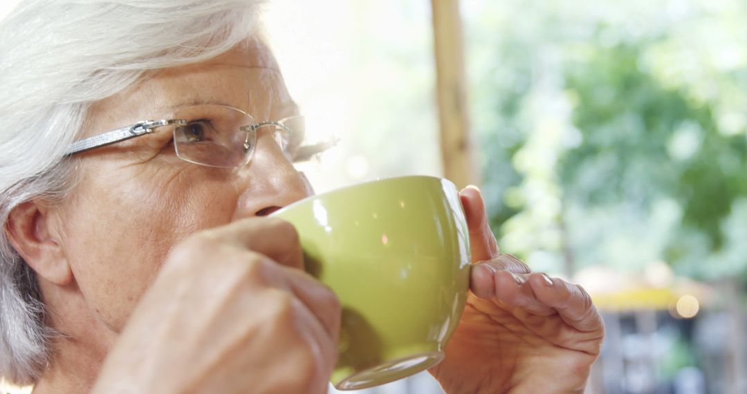 Senior Woman Enjoying Hot Beverage Outdoors - Free Images, Stock Photos and Pictures on Pikwizard.com