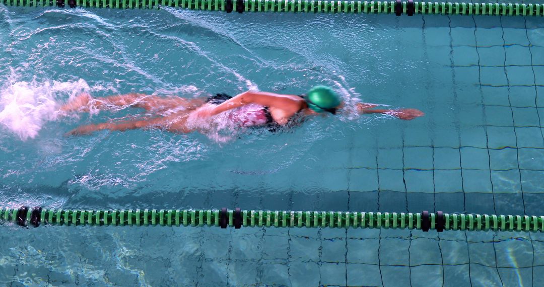 Professional Swimmer Practicing Freestyle Technique in Olympic Pool - Free Images, Stock Photos and Pictures on Pikwizard.com