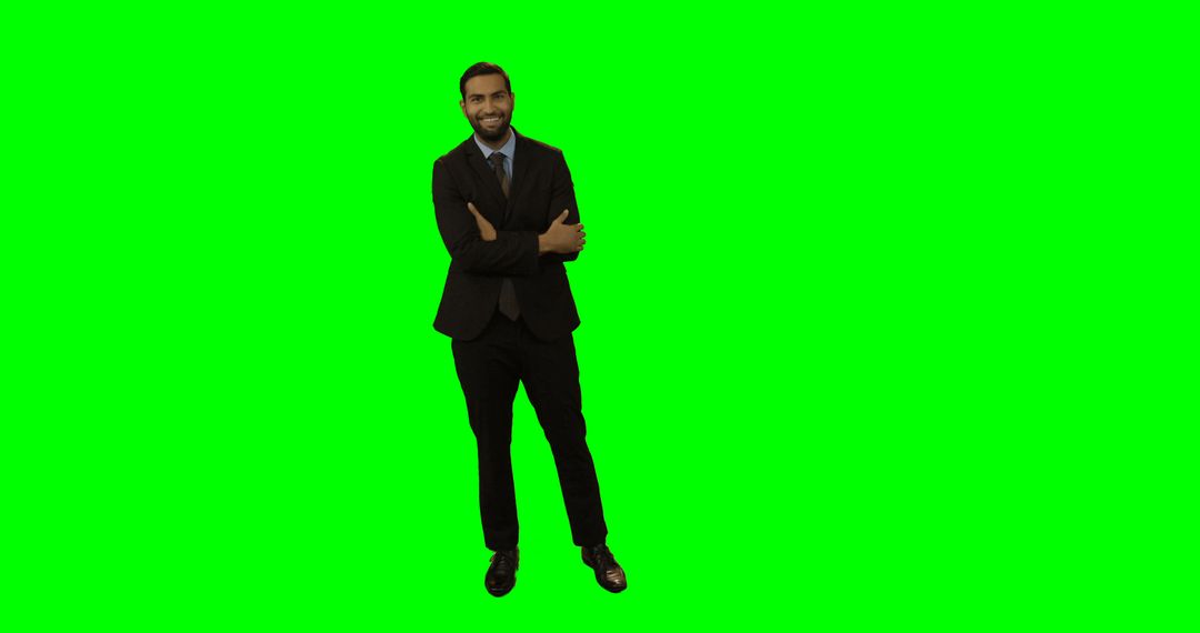 Confident Businessman in Suit Standing on Isolated Green Screen - Free Images, Stock Photos and Pictures on Pikwizard.com