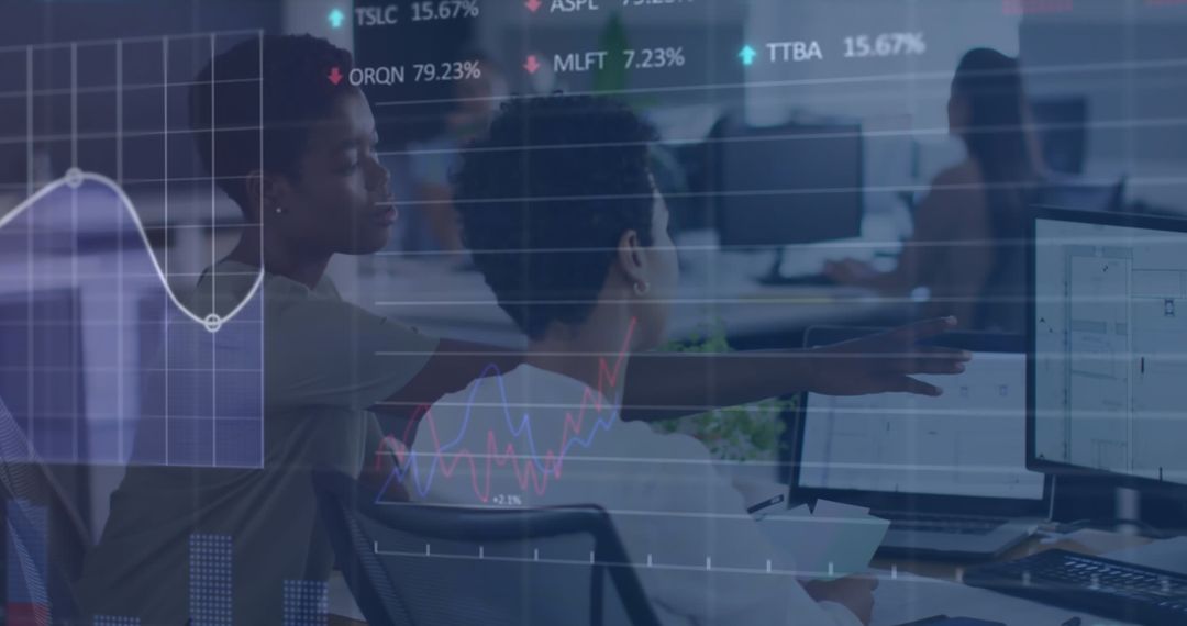 Entrepreneurs Analyzing Financial Data on Digital Screens in Modern Office