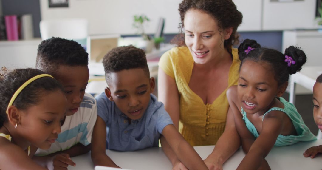 Diverse Group of Children Learning with Teacher