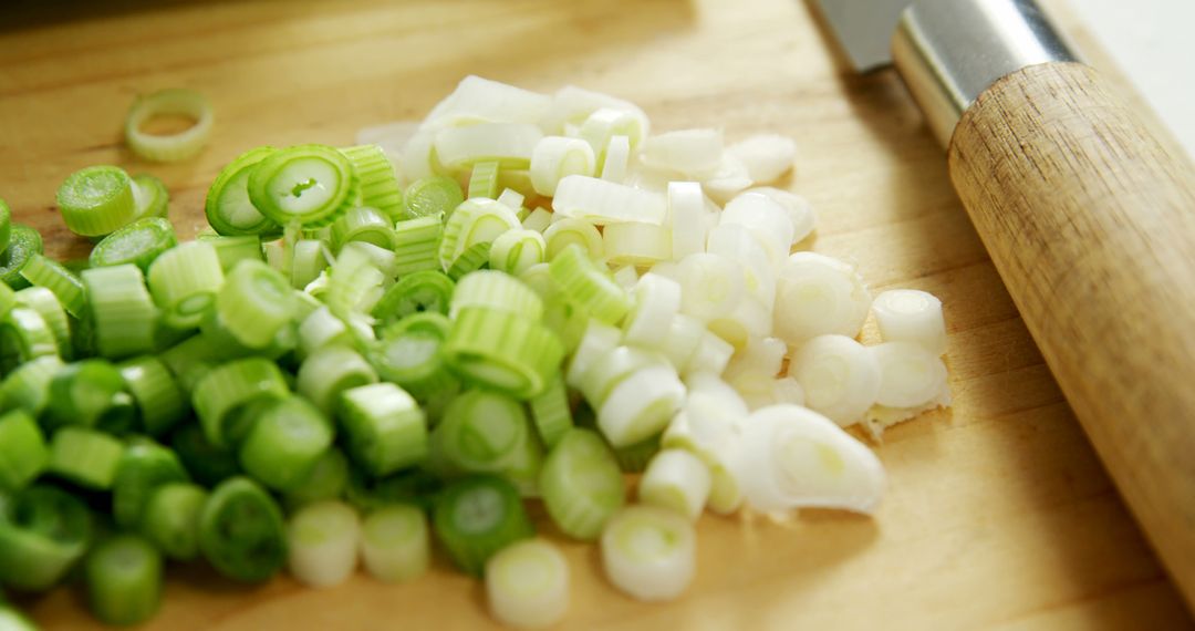 Chopped Green Onions on Cutting Board with Kitchen Knife - Free Images, Stock Photos and Pictures on Pikwizard.com