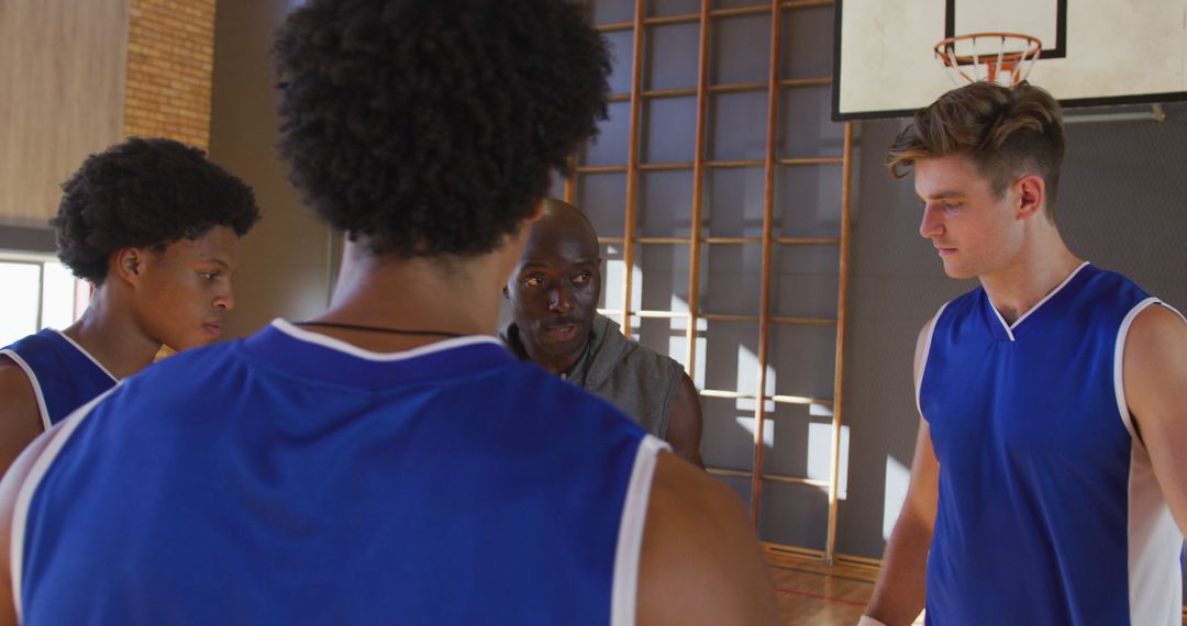 Coach Giving Strategy Talk to Basketball Team Players on Indoor Court - Free Images, Stock Photos and Pictures on Pikwizard.com