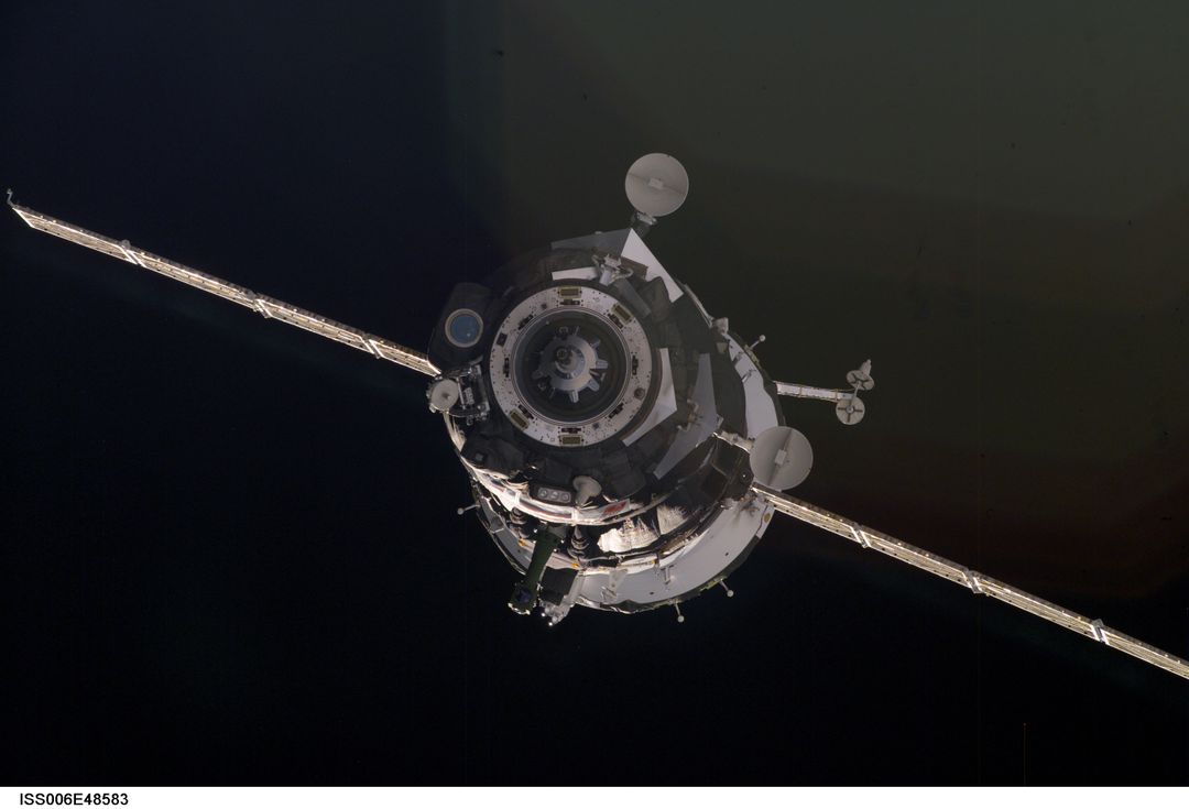View of Soyuz TMA-2 approaching the ISS during Expedition Six - Free Images, Stock Photos and Pictures on Pikwizard.com