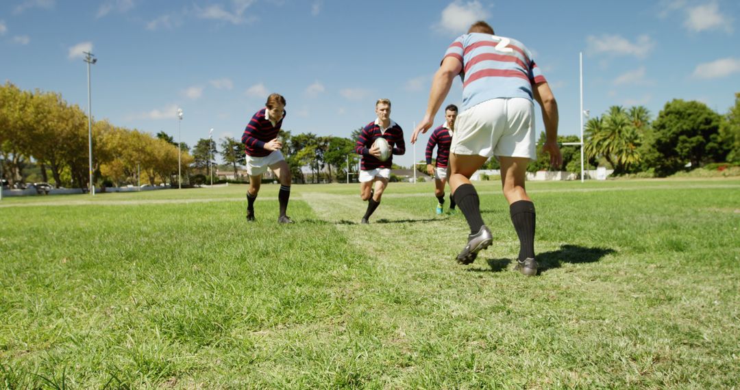 Rugby Players Running on Grass Field During Match - Free Images, Stock Photos and Pictures on Pikwizard.com