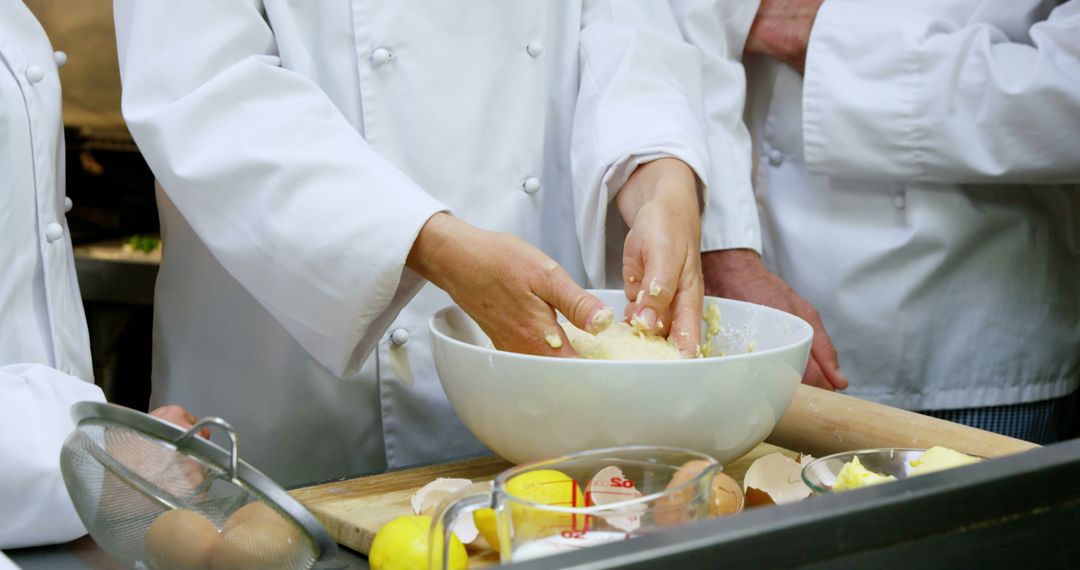 Professional Chefs Preparing Pastry Dough in Commercial Kitchen - Free Images, Stock Photos and Pictures on Pikwizard.com