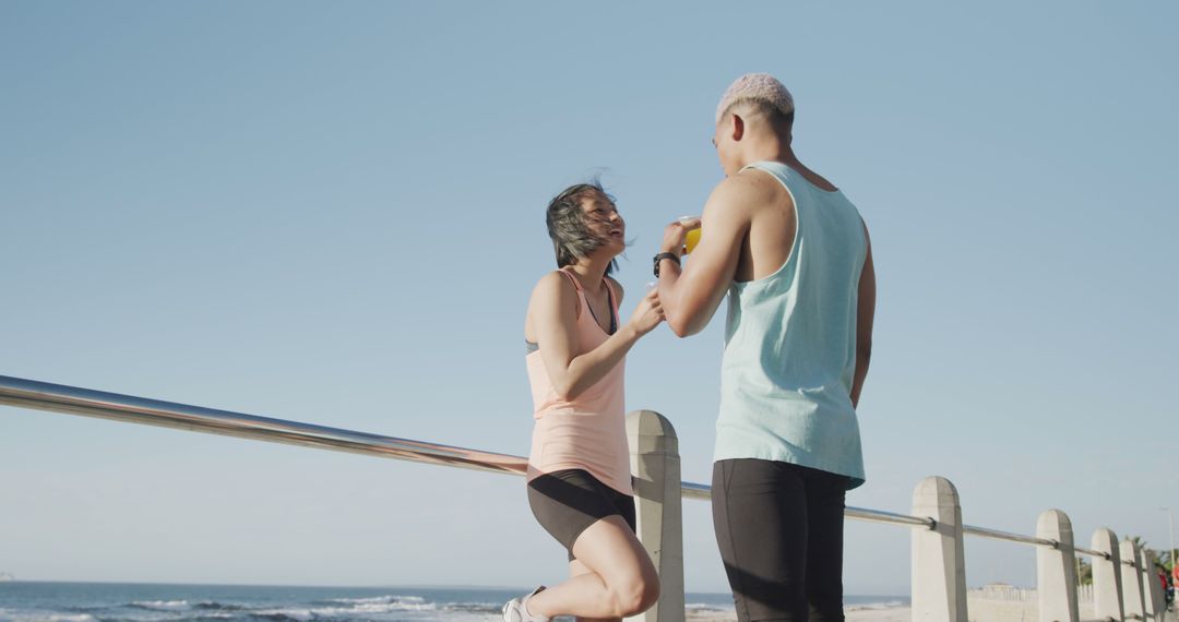 Couple Exercising Together by Seaside - Free Images, Stock Photos and Pictures on Pikwizard.com