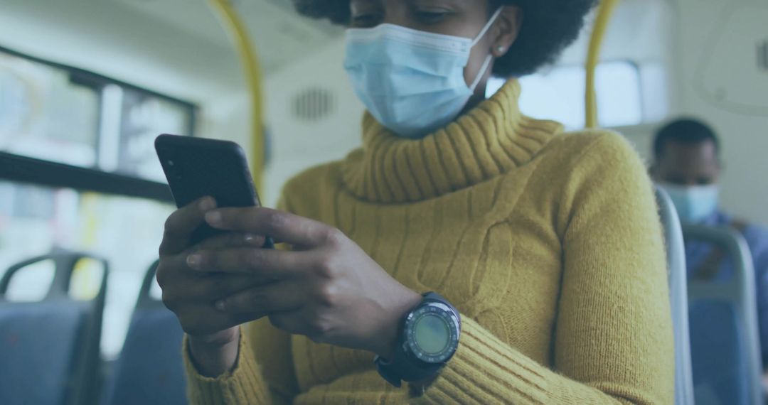 Commuter Wearing Mask on Bus Using Smartphone