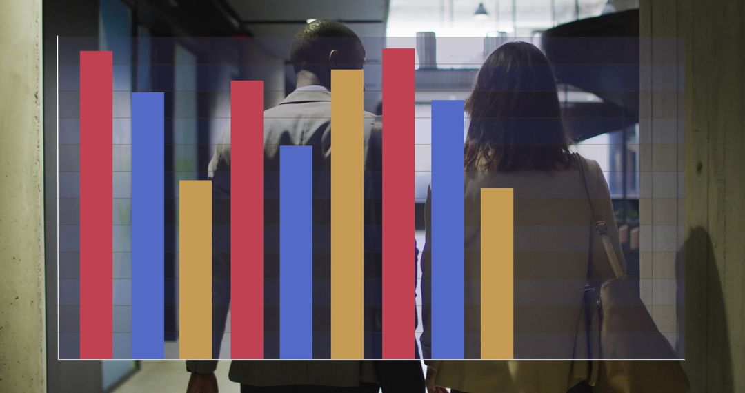 Diverse Colleagues Analyzing Graph Report in Office Corridor